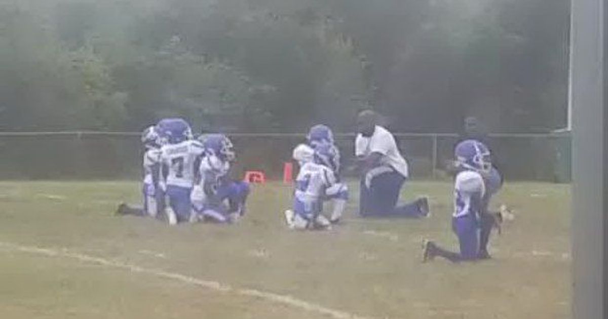 Team of 8-year-old football players kneel in protest during National Anthem