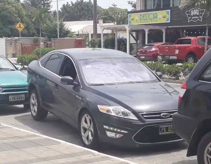 Driver uses some sort of dark magic to get out of a parking spot.