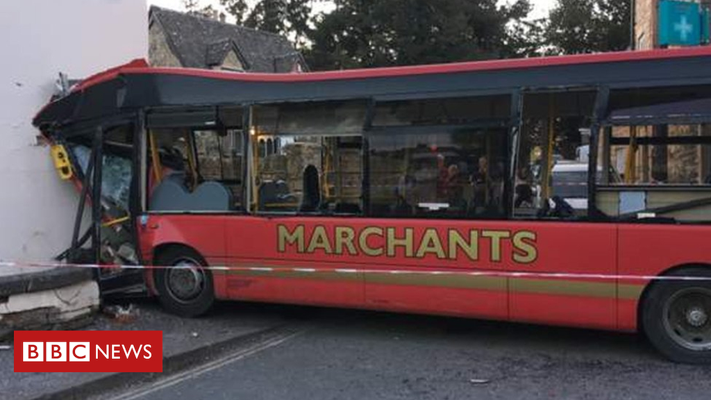 Four hurt as bus crashes into house